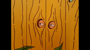 Dale_Gribble_hiding_behind_fence.png