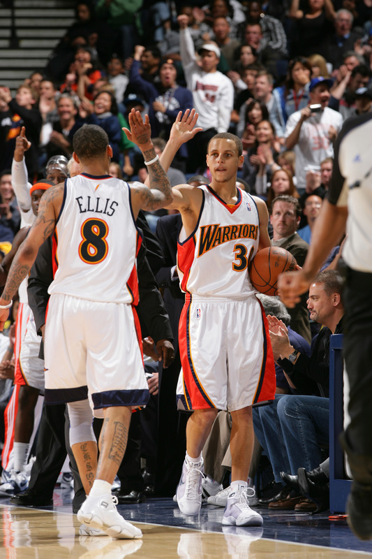 Stephen_Curry__30_And_Monta_Ellis__8_Of_The_Golden_State_Warriors_Give_Each_Other_A_High_Five_In_A_Game_Against_The.jpg