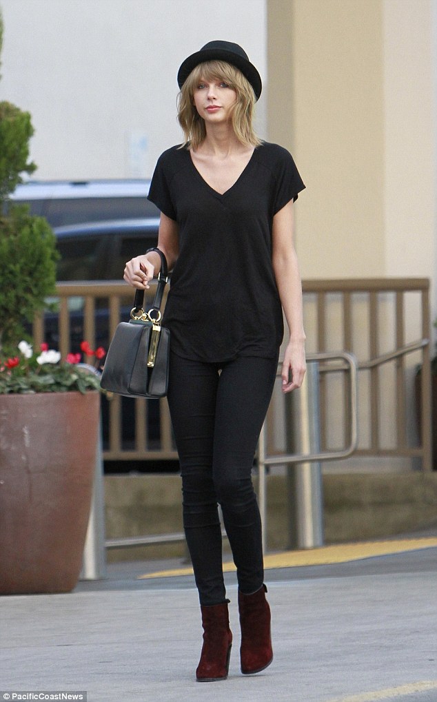 taylor-swift-all-black-attire-red-boots-hat-2.jpg