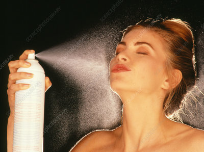 M7300095-Woman_using_water_spray_on_face-SPL.jpg