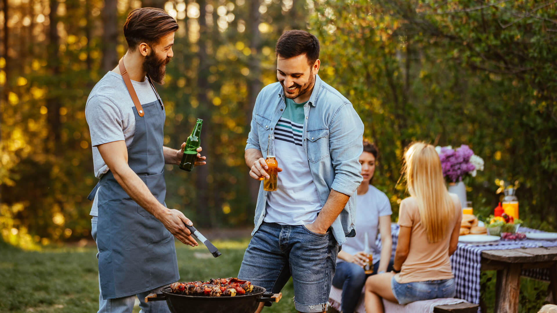 family-friends-barbecuing-iStock-950891664.jpg