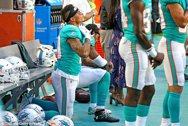 4EFA9D7100000578-6045871-Miami_Dolphins_wide_reviewers_Kenny_Stills_and_Albert_Wilson_kne-m-19_1533874943865.jpg