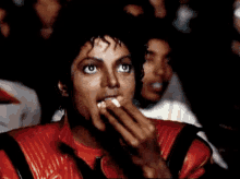 Michael Jackson Watching A Movie And Eating Popcorn GIF - MovieTime Movie Theater GIFs